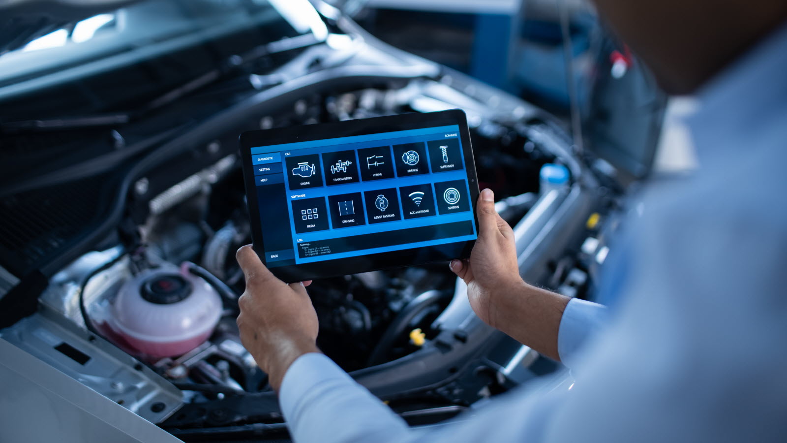 DPF diagnostics – technician reading OBD codes in a car